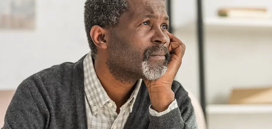 depressed-senior-african-american-man-holding-han-2024-11-17-05-47-37-utc
