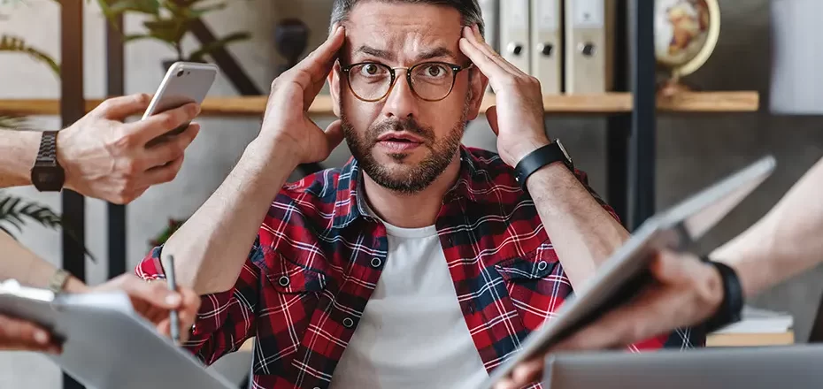 overworked-businessman-sitting-at-laptop-overloade-2025-01-09-18-05-21-utc